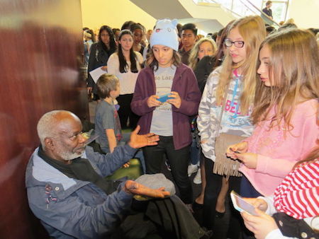Actor Joseph Marcell is mobbed by fans seeking "selfies"